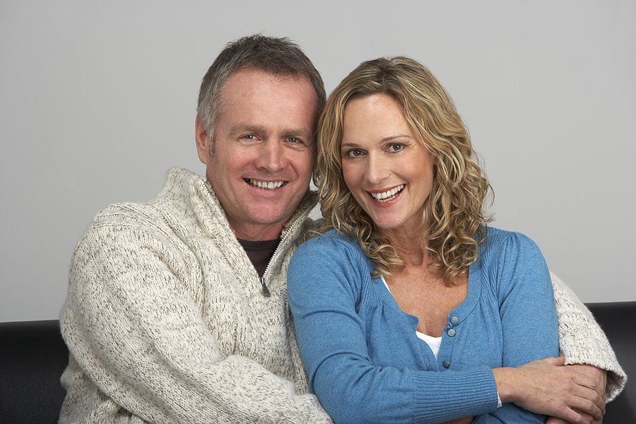 bigstock_Middle_Aged_Couple_Sitting_On__13899617_zps96cacc9a.jpe