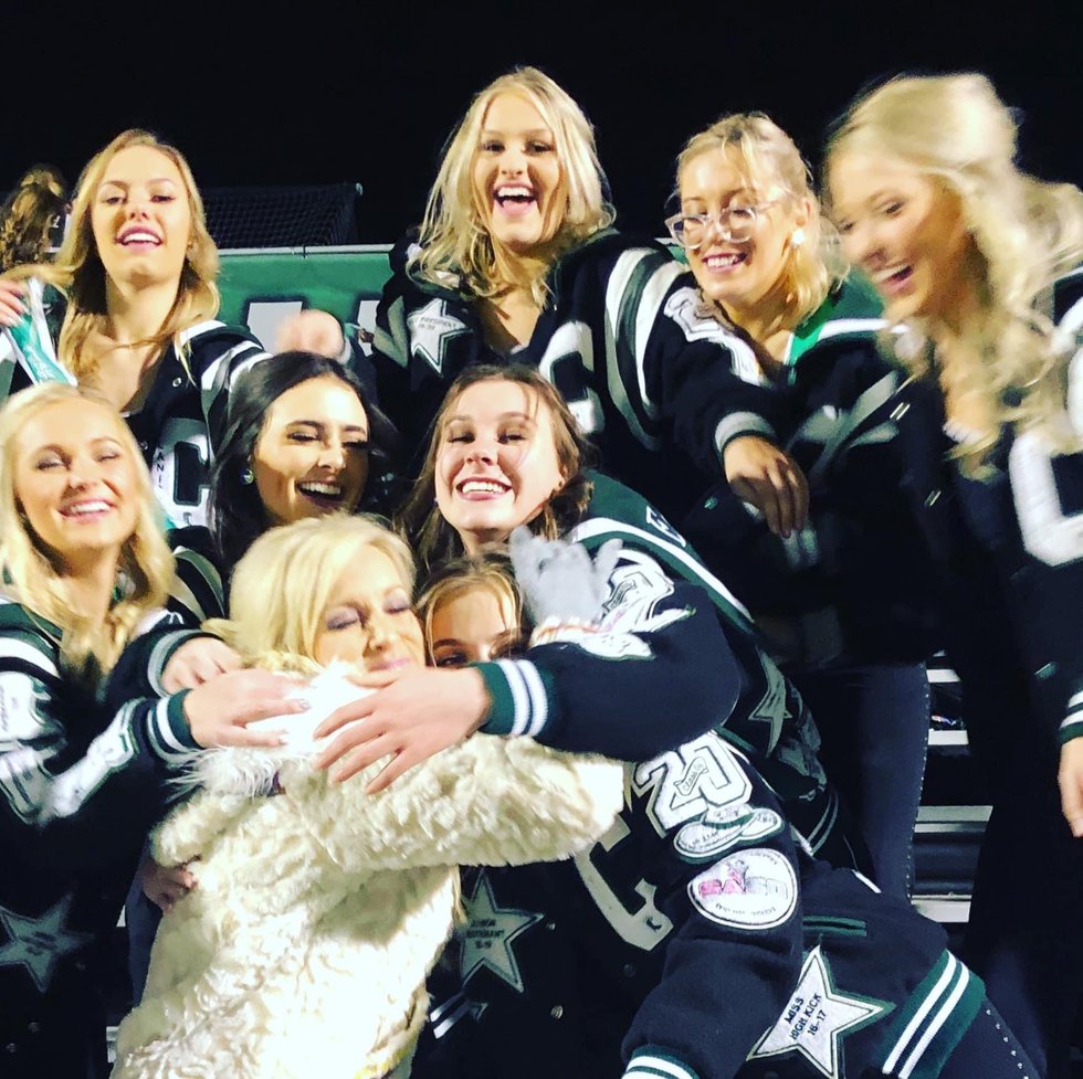 2019 Melissa Page in stands hug girls copy.jpeg