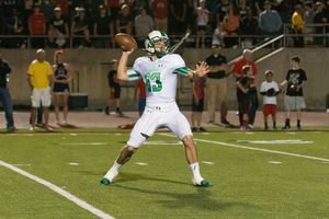 Mason Holmes drops back to pass during a 38-37 Dragons victory over Coppell Photo by StewartSnappedDragonscom