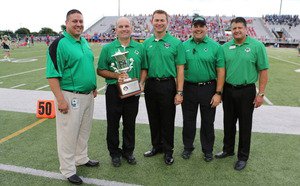 CSHS Principal Shawn Duhon center accepts Southlakes 3rd straight UIL Lone Star Cup during a ceremony before the 2014 football season opener at Dragon Stadium