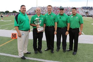 CSHS Principal Shawn Duhon center accepts Southlakes 3rd straight UIL Lone Star Cup during a ceremony before the football season opener at Dragon Stadium